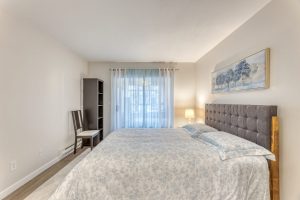 North Vancouver condo for sale Lower Lonsdale primary bedroom with wardrobe