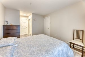 North Vancouver condo for sale Lower Lonsdale second bedroom with blue bedding