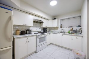 Renovated Kitchen - 2418 Warrenton Ave Central Coquitlam - White Cabinets Modern Appliances